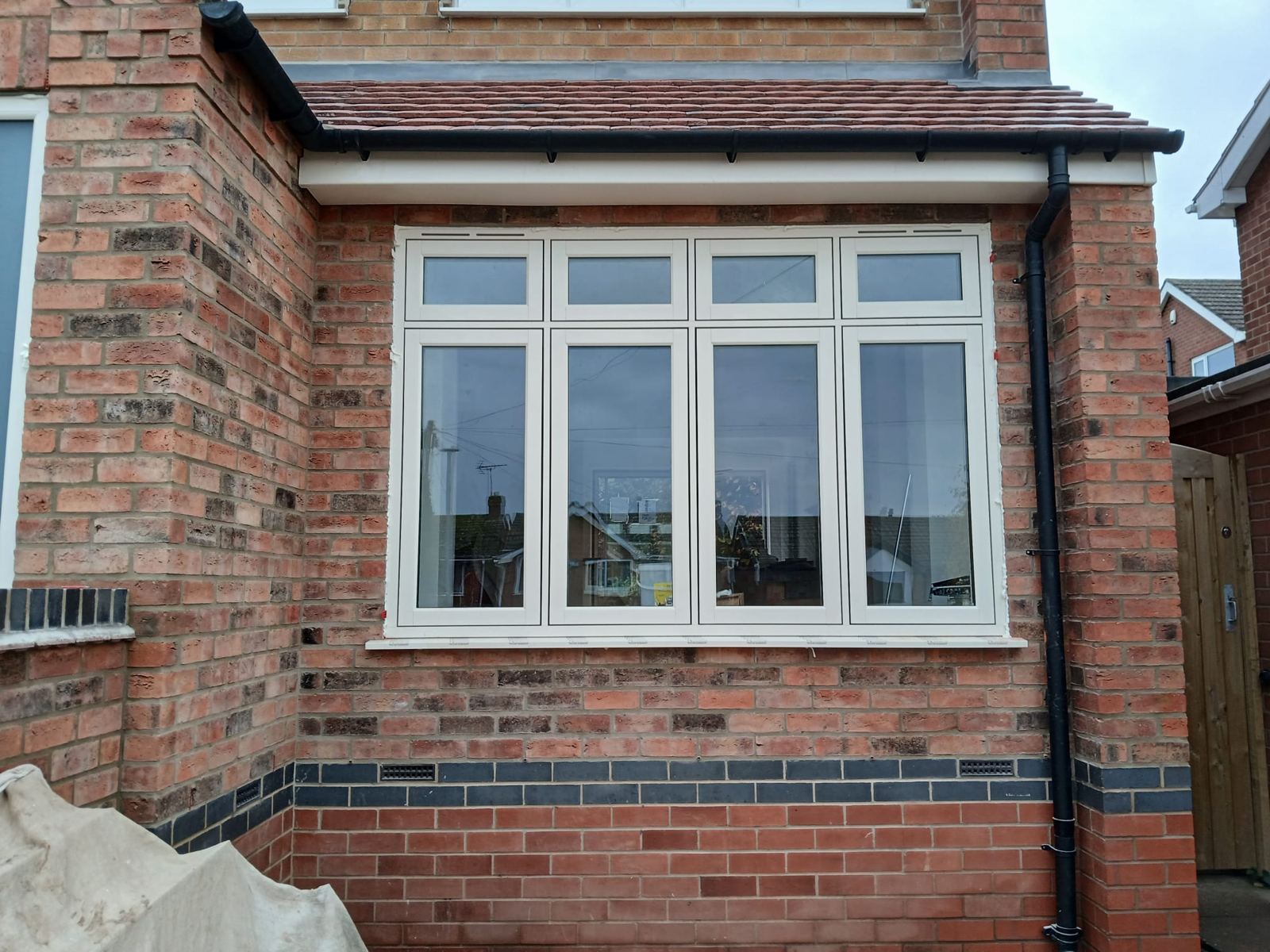 Front extension with the blue-brick band carried through