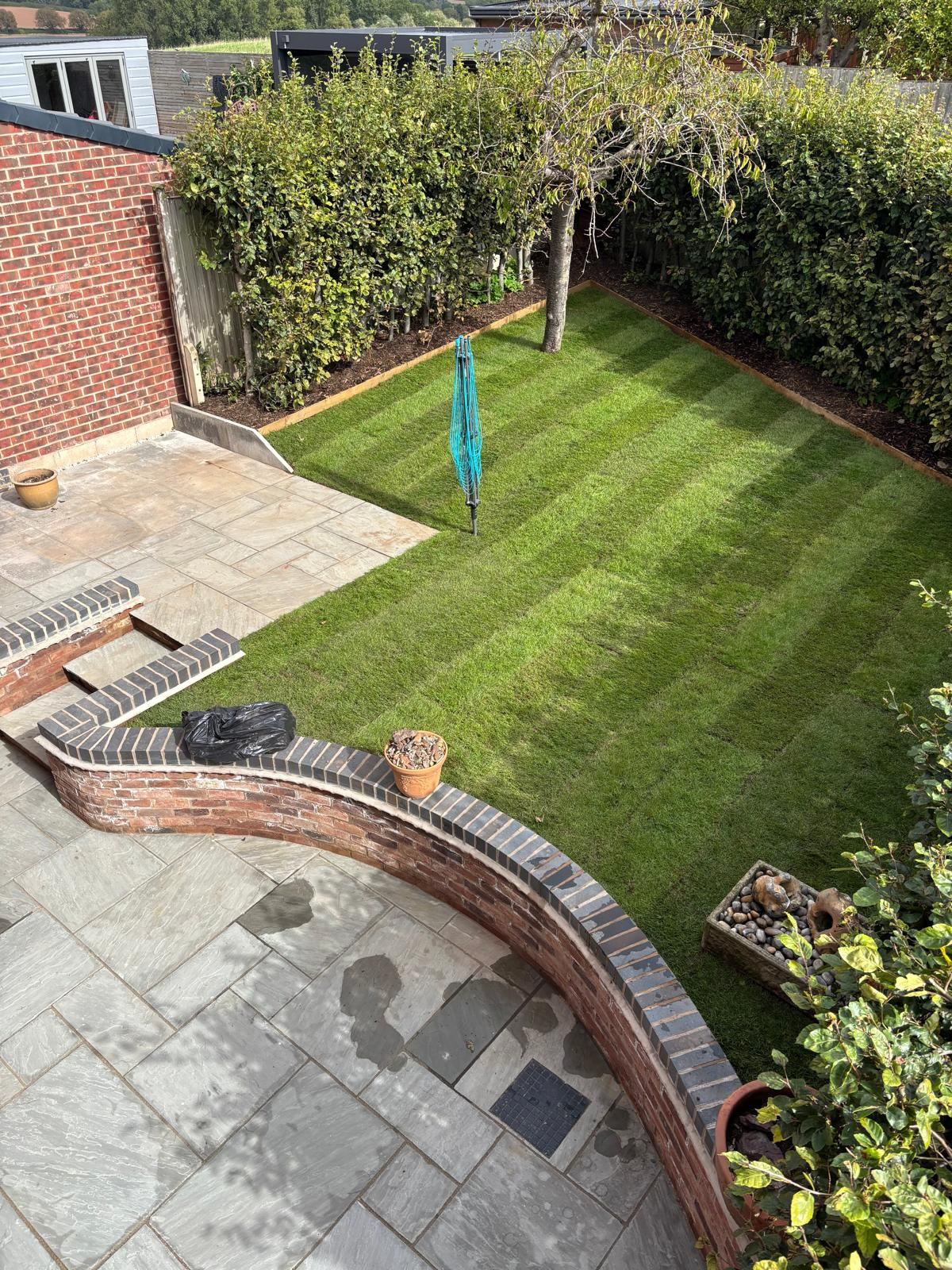 Retaining wall, terrace and new lawn