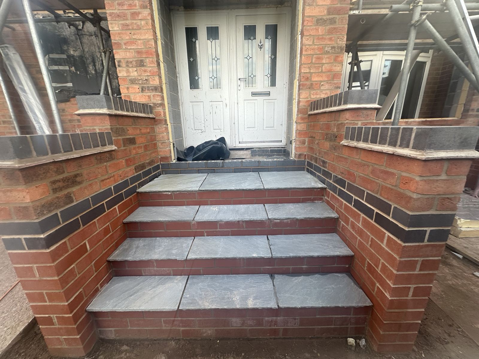 New entrance steps in matched brick