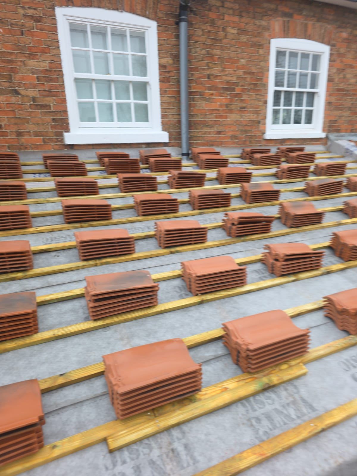 Clay pantiles loaded out on the adjoining roof